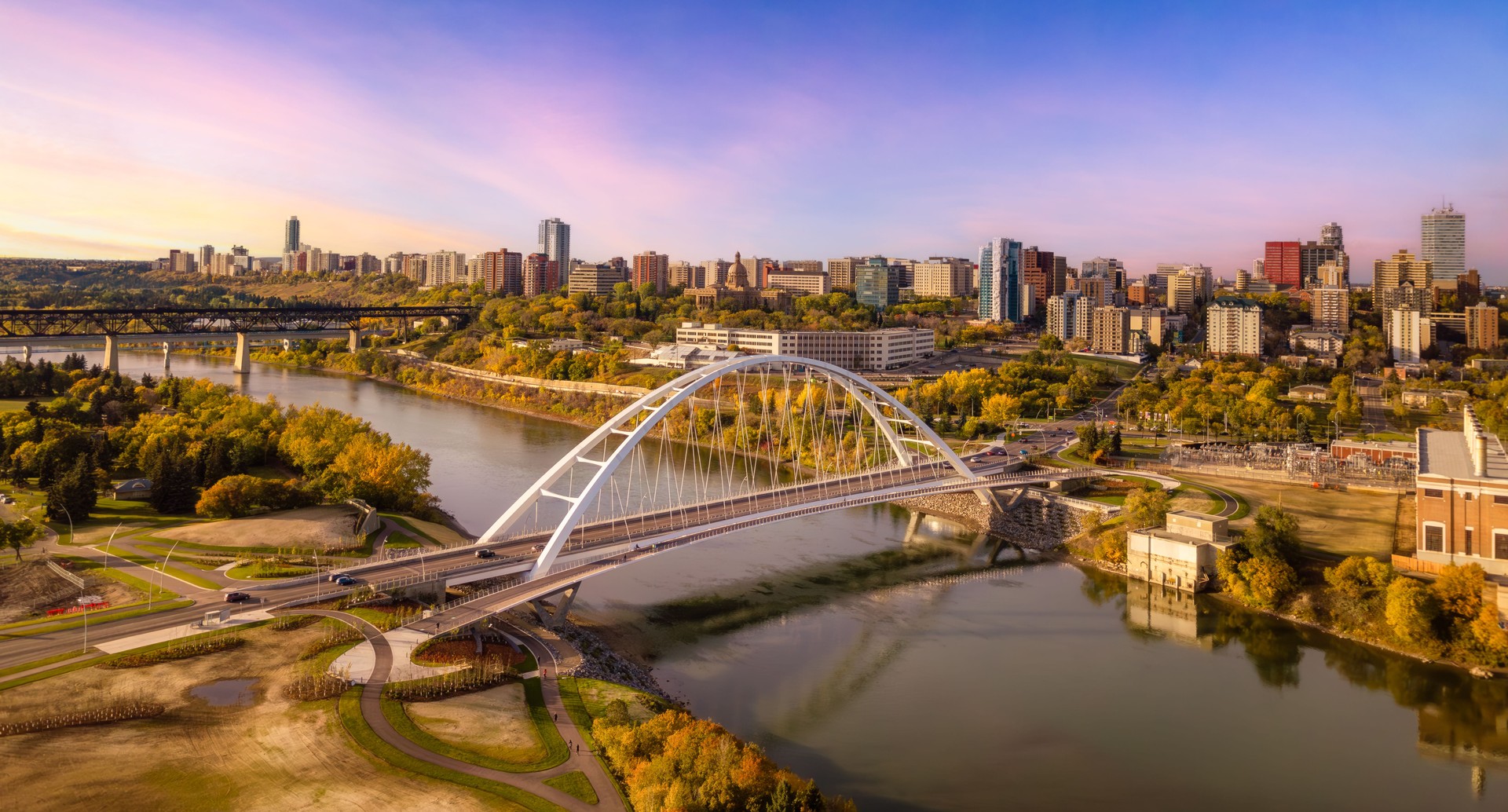 Aerial of a bridge over the river with the city in the background in Edmonton, Alberta, Canada.